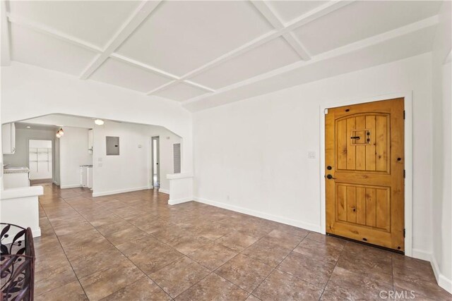 8727 S Harvard Blvd, Los Angeles, CA 90047 - unfurnished living room with electric panel, coffered ceiling, and beamed ceiling