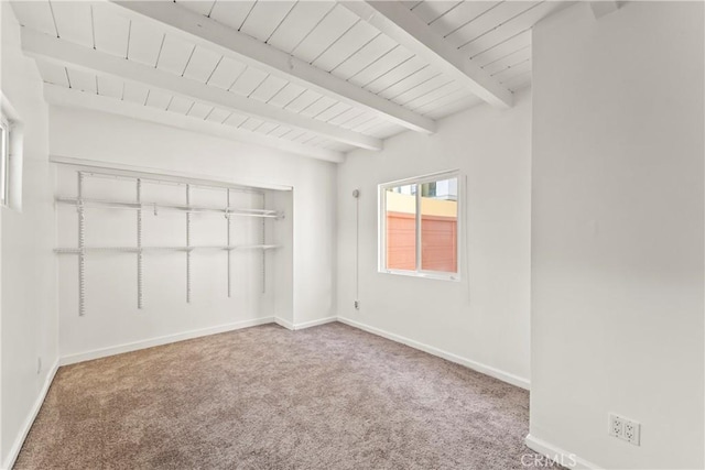 8727 S Harvard Blvd, Los Angeles, CA 90047 - unfurnished bedroom featuring carpet and a wooden ceiling with exposed beams