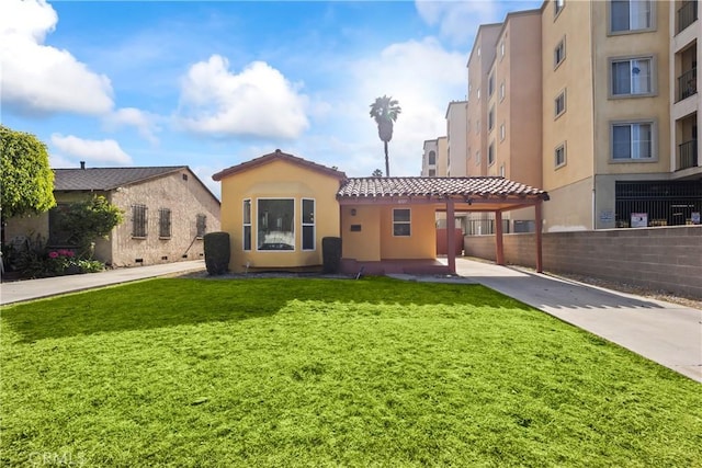 8727 S Harvard Blvd, Los Angeles, CA 90047 - view of front of home featuring stucco siding, a carport, concrete driveway, and a tiled roof