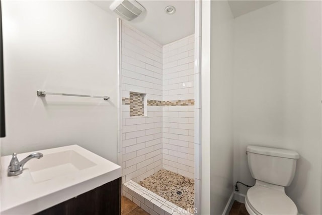 8727 S Harvard Blvd, Los Angeles, CA 90047 - bathroom featuring tiled shower, vanity, and tile patterned floors