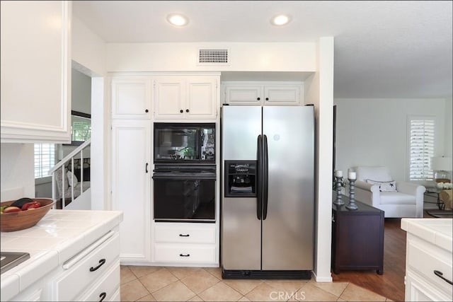 3 Blue Heron Ln, Aliso Viejo, CA 92656 - kitchen featuring black appliances, tile counters, white cabinets, recessed lighting, and light tile patterned floors