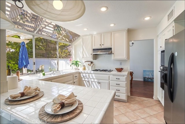 3 Blue Heron Ln, Aliso Viejo, CA 92656 - kitchen with tile countertops, freestanding refrigerator, plenty of natural light, and recessed lighting