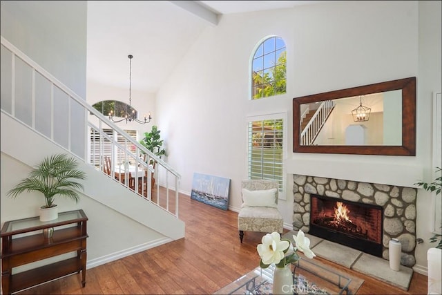 3 Blue Heron Ln, Aliso Viejo, CA 92656 - living area featuring stairway, hardwood / wood-style floors, beam ceiling, a chandelier, and plenty of natural light