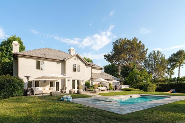 17274 Calle Mayor, Rancho Santa Fe, CA 92067 - rear view of house with a chimney, an outdoor living space, and a lawn