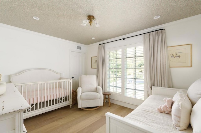 17274 Calle Mayor, Rancho Santa Fe, CA 92067 - bedroom featuring crown molding, a textured ceiling, light wood finished floors, and recessed lighting