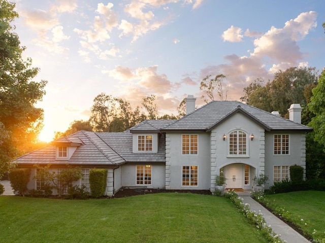 17274 Calle Mayor, Rancho Santa Fe, CA 92067 - view of front facade featuring a chimney, a yard, and stucco siding