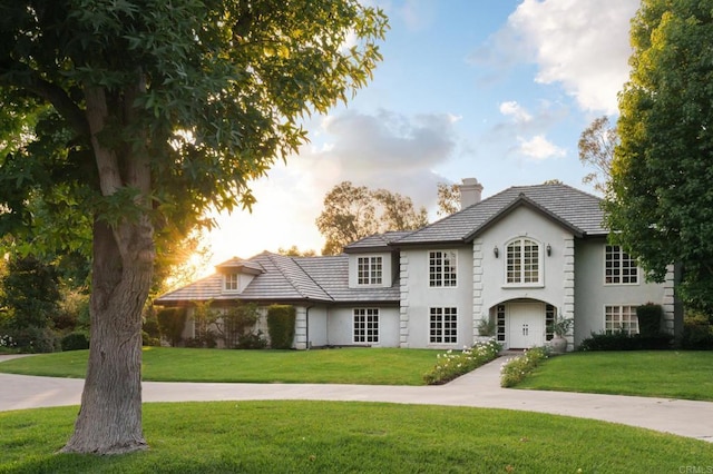 17274 Calle Mayor, Rancho Santa Fe, CA 92067 - view of front of house with a chimney, a front lawn, and stucco siding