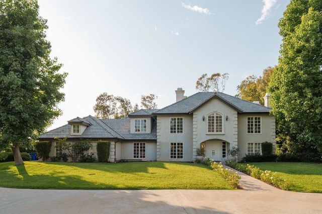 17274 Calle Mayor, Rancho Santa Fe, CA 92067 - view of front of house with a chimney, a front lawn, and stucco siding