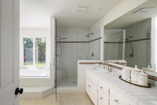 17274 Calle Mayor, Rancho Santa Fe, CA 92067 - full bathroom with a stall shower, vanity, a bath, and tile patterned flooring