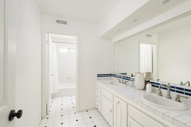 17274 Calle Mayor, Rancho Santa Fe, CA 92067 - full bath featuring tile patterned floors, double vanity, shower / tub combo with curtain, and backsplash