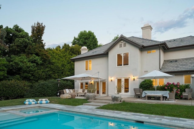 17274 Calle Mayor, Rancho Santa Fe, CA 92067 - back of house featuring french doors, a chimney, outdoor lounge area, and stucco siding