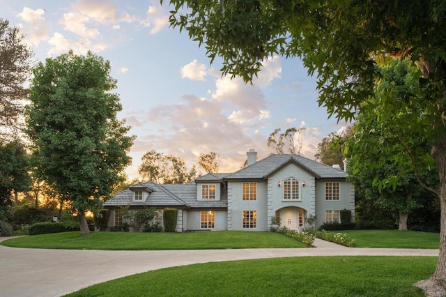 17274 Calle Mayor, Rancho Santa Fe, CA 92067 - view of front of home featuring a chimney, a front yard, and stucco siding