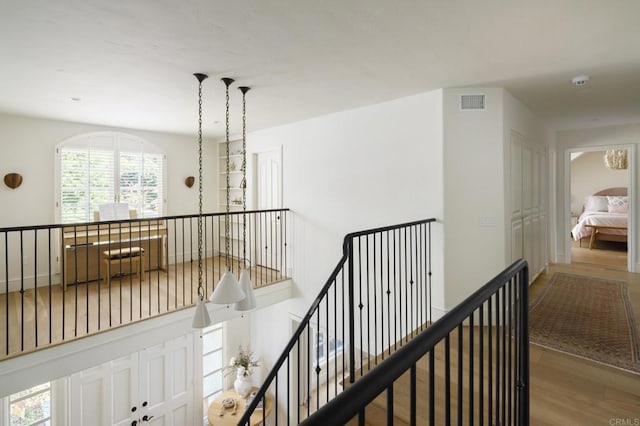 17274 Calle Mayor, Rancho Santa Fe, CA 92067 - hall featuring wood finished floors and an upstairs landing