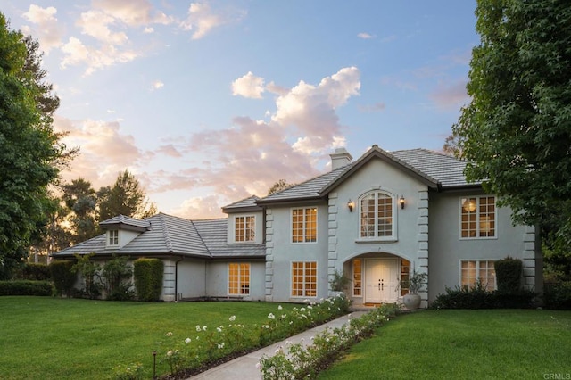 17274 Calle Mayor, Rancho Santa Fe, CA 92067 - french provincial home featuring a chimney, a yard, stucco siding, and a tiled roof