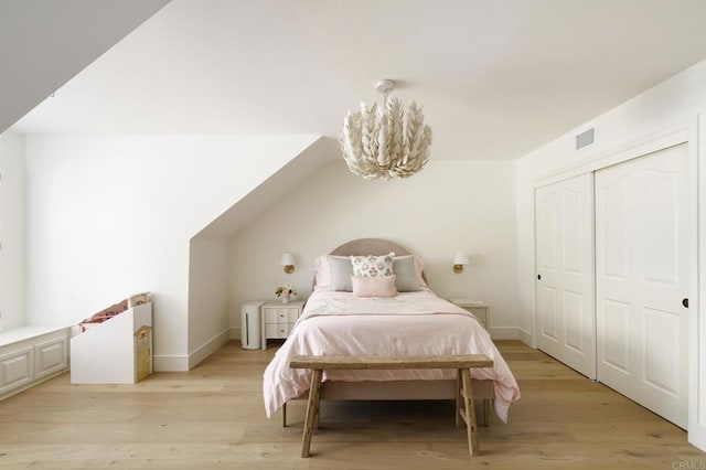 17274 Calle Mayor, Rancho Santa Fe, CA 92067 - bedroom featuring light wood finished floors, a closet, and a chandelier