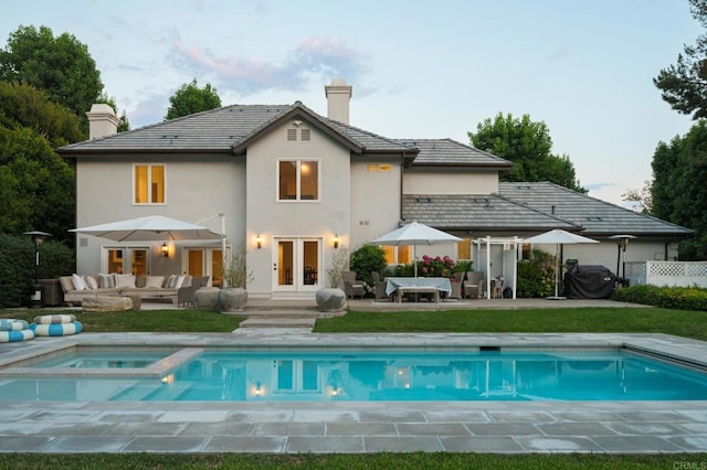17274 Calle Mayor, Rancho Santa Fe, CA 92067 - back of property featuring french doors, an outdoor living space, a chimney, a patio area, and stucco siding