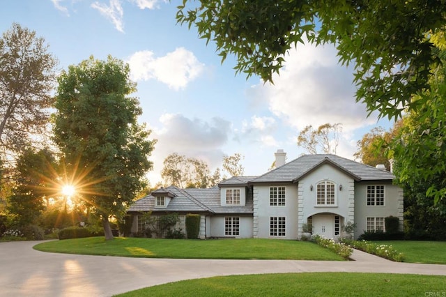 17274 Calle Mayor, Rancho Santa Fe, CA 92067 - view of front of home with a chimney, a front lawn, and stucco siding