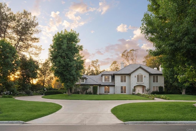 17274 Calle Mayor, Rancho Santa Fe, CA 92067 - view of front facade with a front lawn, curved driveway, and a chimney