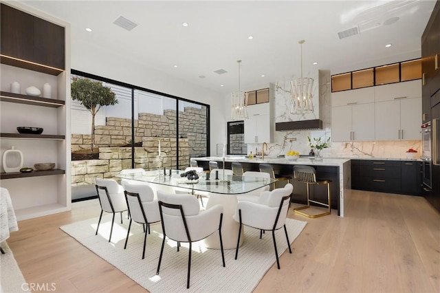 19031 Fowler Ave, North Tustin, CA 92705 - dining room with light wood-style flooring, recessed lighting, and a chandelier