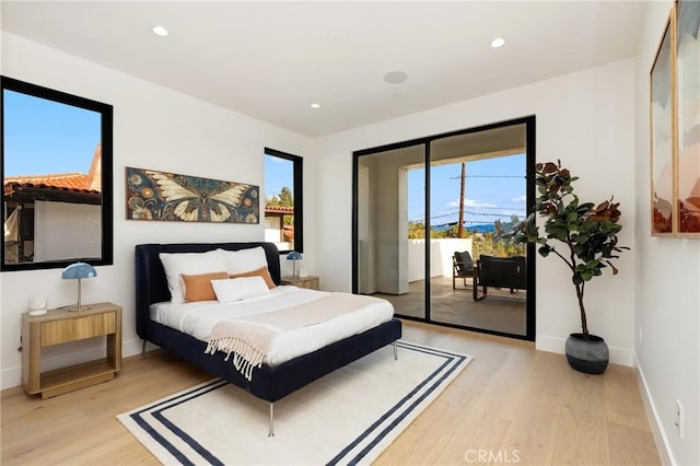 19031 Fowler Ave, North Tustin, CA 92705 - bedroom featuring access to exterior, light wood-style floors, multiple windows, and recessed lighting