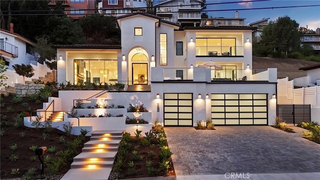 19031 Fowler Ave, North Tustin, CA 92705 - view of front facade with stairs, stucco siding, driveway, and a garage