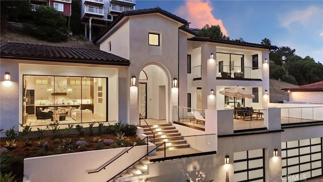 19031 Fowler Ave, North Tustin, CA 92705 - back of house with stairway, a balcony, a tiled roof, and stucco siding