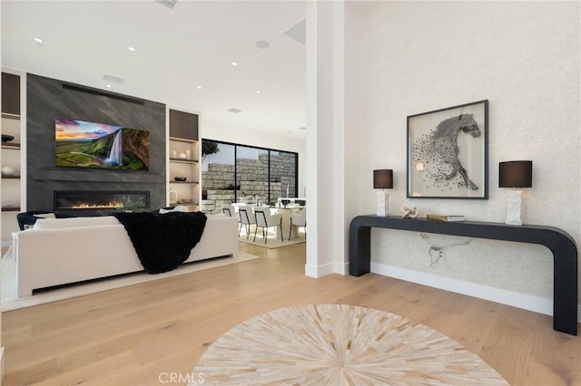 19031 Fowler Ave, North Tustin, CA 92705 - living room featuring wood finished floors, a large fireplace, and recessed lighting