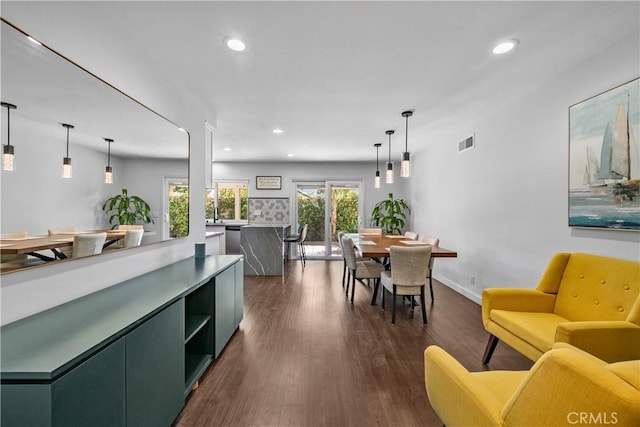 27814 Caraway Ln, Saugus, CA 91350 - kitchen with green cabinetry, recessed lighting, dark wood-type flooring, stainless steel dishwasher, and light countertops