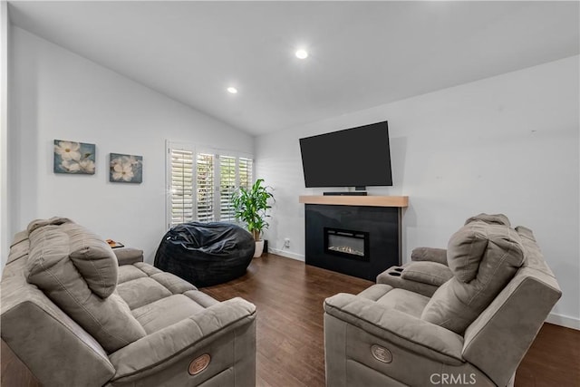 27814 Caraway Ln, Saugus, CA 91350 - living area featuring dark wood-style floors, recessed lighting, vaulted ceiling, and a glass covered fireplace