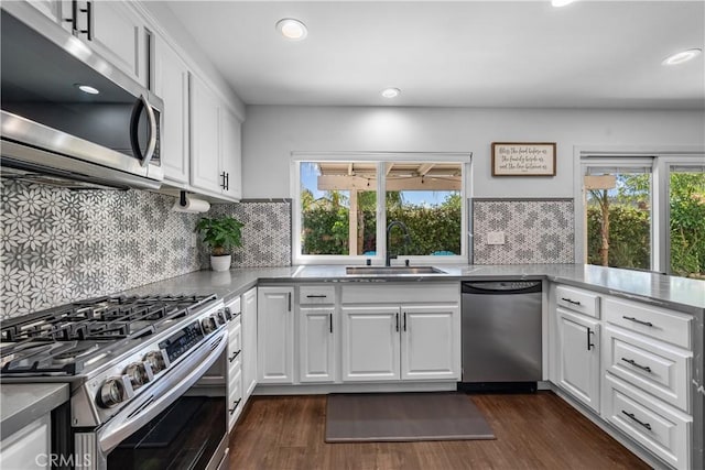 27814 Caraway Ln, Saugus, CA 91350 - kitchen with stainless steel appliances, healthy amount of natural light, white cabinets, and recessed lighting