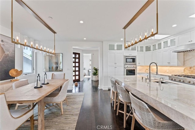 444 Morning Canyon Rd, Corona Del Mar, CA 92625 - dining area featuring dark wood-type flooring, plenty of natural light, and recessed lighting