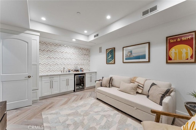 444 Morning Canyon Rd, Corona Del Mar, CA 92625 - living area featuring beverage cooler, wet bar, and recessed lighting