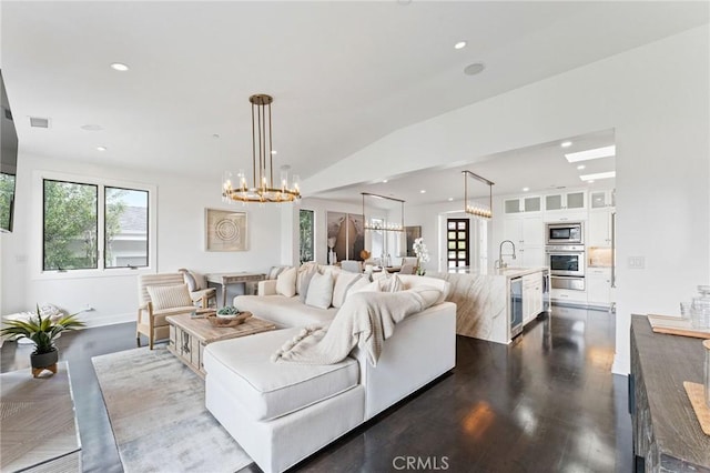 444 Morning Canyon Rd, Corona Del Mar, CA 92625 - living room with wine cooler, healthy amount of natural light, a chandelier, recessed lighting, and dark wood finished floors