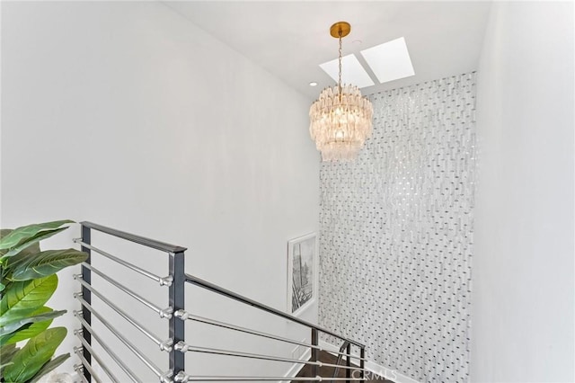 444 Morning Canyon Rd, Corona Del Mar, CA 92625 - stairs with a chandelier and a skylight