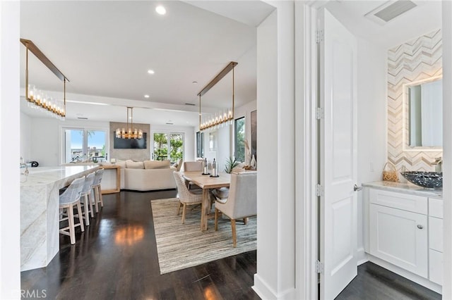 444 Morning Canyon Rd, Corona Del Mar, CA 92625 - dining space with dark wood-style flooring, recessed lighting, and a chandelier