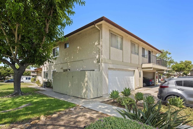 9847 Mission Vega Rd Unit 3, Santee, CA 92071 - view of home's exterior featuring stucco siding, a garage, and concrete driveway