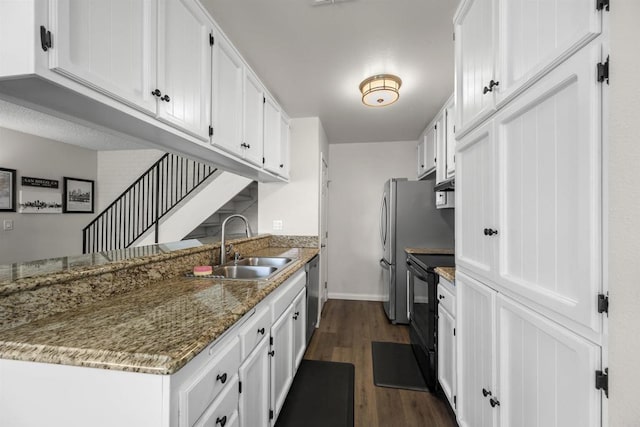 9847 Mission Vega Rd Unit 3, Santee, CA 92071 - kitchen with black electric range oven, dishwasher, white cabinetry, dark wood-style flooring, and stone countertops