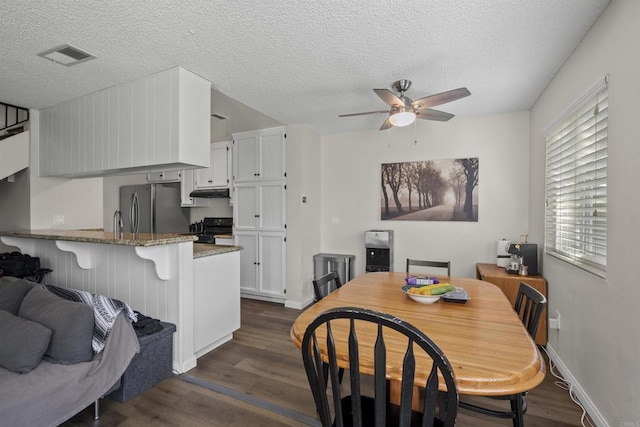 9847 Mission Vega Rd Unit 3, Santee, CA 92071 - dining room with ceiling fan, dark wood-style floors, and a textured ceiling