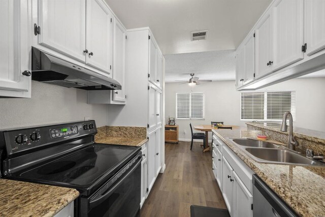 9847 Mission Vega Rd Unit 3, Santee, CA 92071 - kitchen with black electric range oven, under cabinet range hood, ceiling fan, white cabinets, and dark wood-style floors