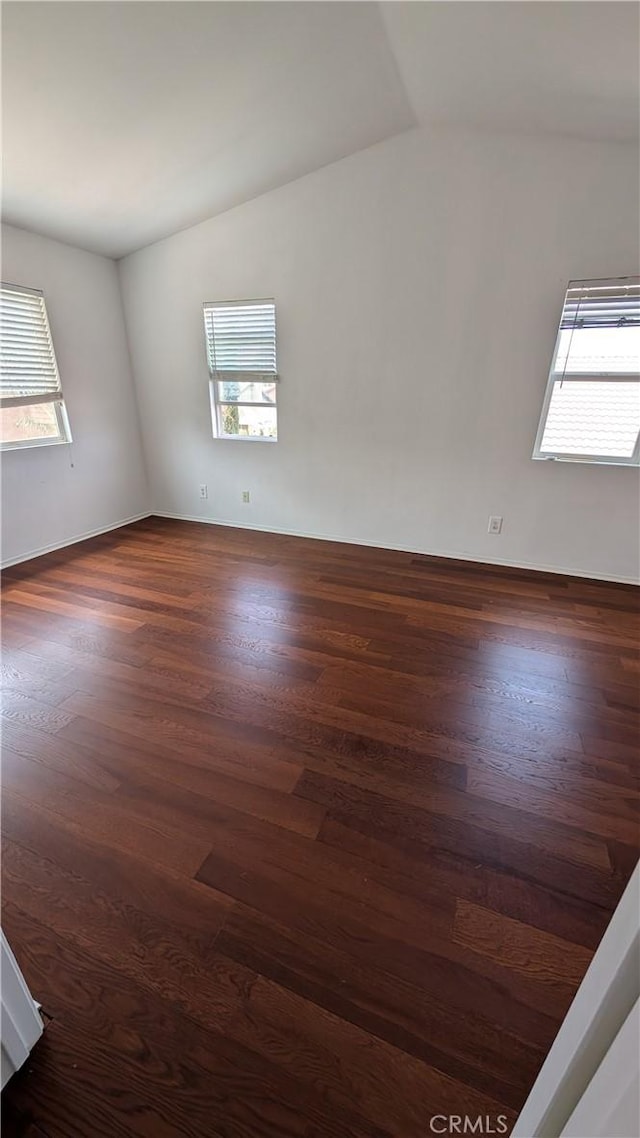 1679 Stoneside Dr, Hemet, CA 92545 - spare room featuring lofted ceiling and dark wood-style floors