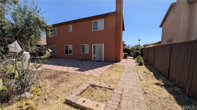 1679 Stoneside Dr, Hemet, CA 92545 - back of property with a fenced backyard, a patio, and stucco siding