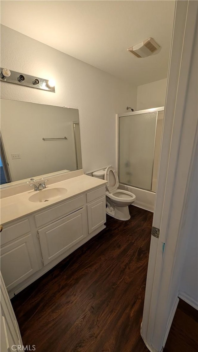 1679 Stoneside Dr, Hemet, CA 92545 - full bathroom with wood finished floors, vanity, and combined bath / shower with glass door
