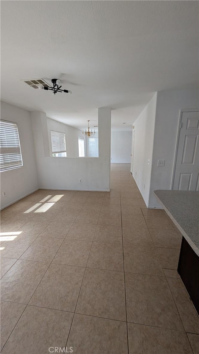 1679 Stoneside Dr, Hemet, CA 92545 - spare room featuring a chandelier and tile patterned flooring