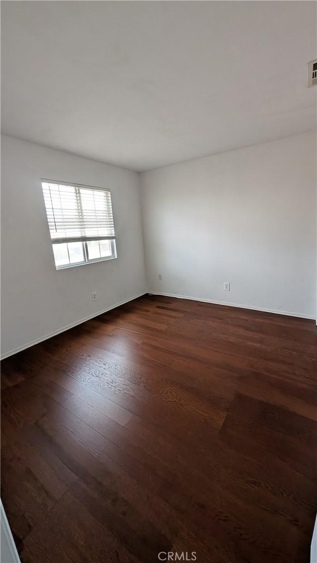 1679 Stoneside Dr, Hemet, CA 92545 - unfurnished room featuring dark wood-type flooring and baseboards