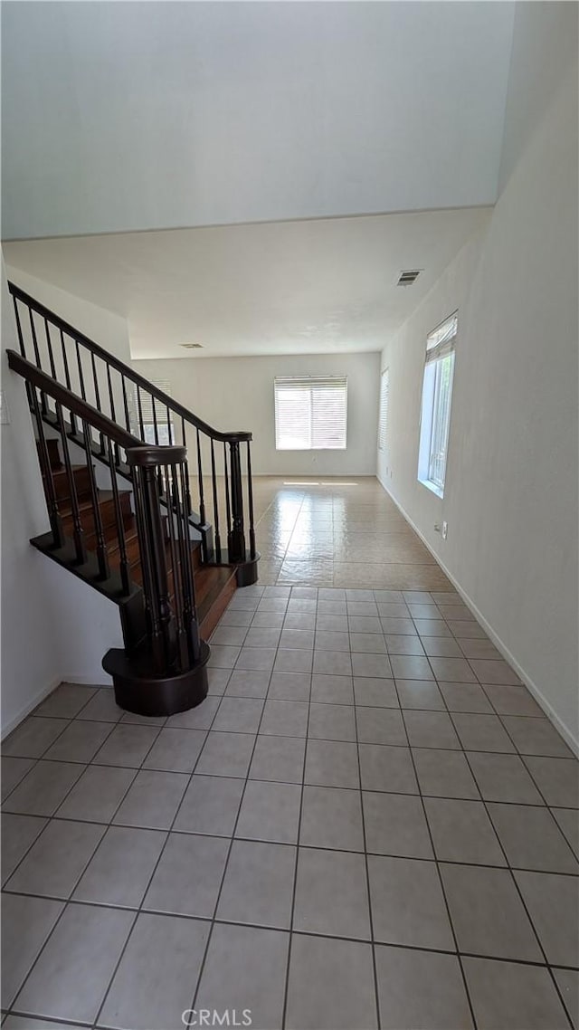1679 Stoneside Dr, Hemet, CA 92545 - staircase with tile patterned flooring and baseboards