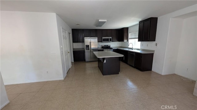 1679 Stoneside Dr, Hemet, CA 92545 - kitchen featuring stainless steel appliances, a kitchen island, light countertops, and light tile patterned floors
