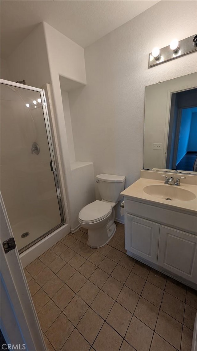 1679 Stoneside Dr, Hemet, CA 92545 - bathroom featuring tile patterned flooring, a stall shower, and vanity