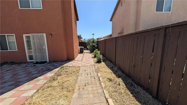 1679 Stoneside Dr, Hemet, CA 92545 - view of side of property with stucco siding, a fenced backyard, and a patio area