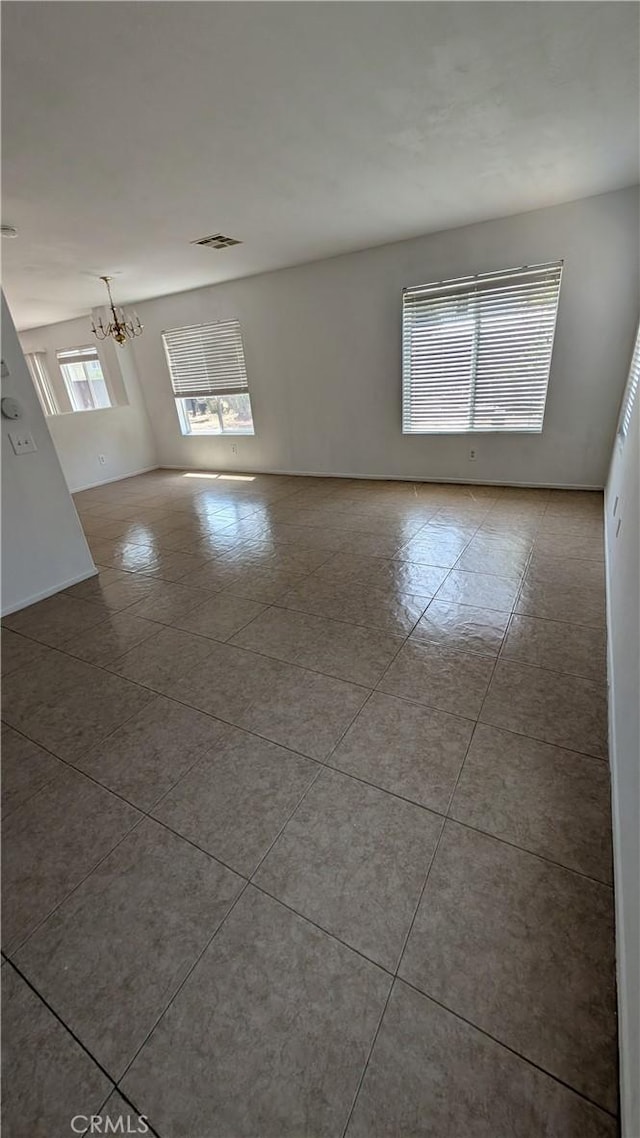 1679 Stoneside Dr, Hemet, CA 92545 - tiled spare room with a chandelier