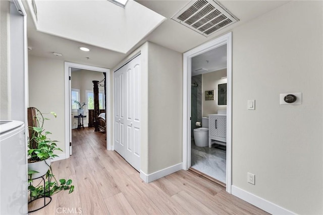 166 Alta St Unit B, Arcadia, CA 91006 - corridor with light wood-type flooring and washer / clothes dryer